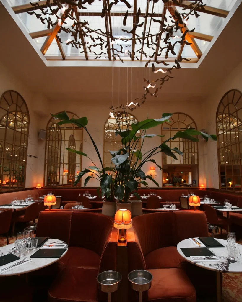 Elegant main dining room with arched windows at Siena Paris