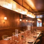 Intimate private dining area with wood paneling at Siena Parisv