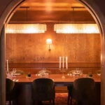 Intimate wood-paneled dining room at Siena Paris restaurant