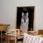 Round table set beneath a large black-and-white wolf photograph at SPOT Palma De Mallorca