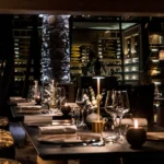 Candlelit dining area inside L'Altiplano at K2 Palace Courchevel