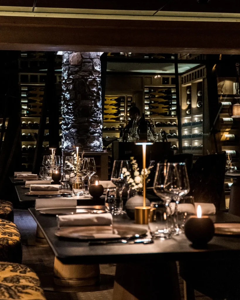 Candlelit dining area inside L'Altiplano at K2 Palace Courchevel