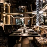 Warm wood and stone restaurant interior at L'Altiplano K2 Palace