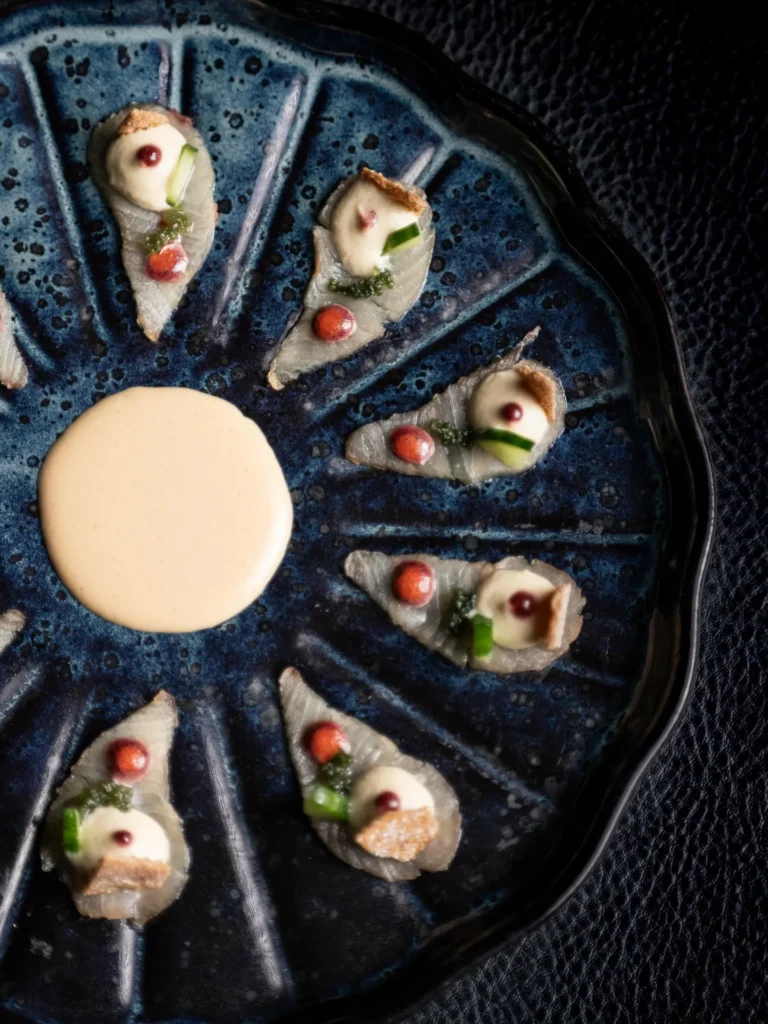 Seafood platter with dipping sauce served at L'Altiplano K2 Palace