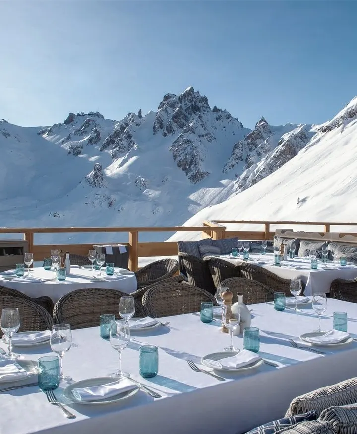Mountain landscape and outdoor dining area at Bagatelle Courchevel