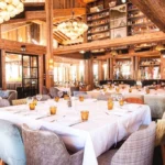 Elegant dining tables inside Baïes Courchevel
