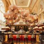 BeauCoCo Paris bar surrounded by lush floral and botanical decor