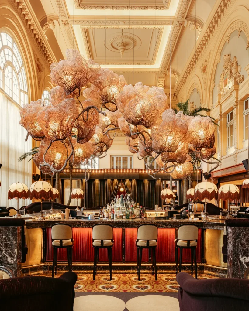 BeauCoCo Paris bar surrounded by lush floral and botanical decor