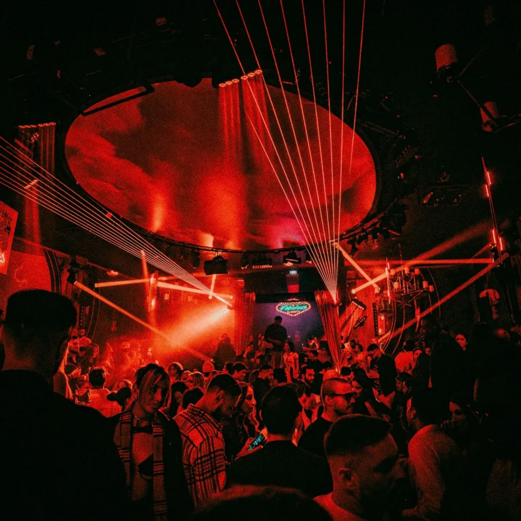 Red-lit club interior filled with guests at Boum Boum Paris