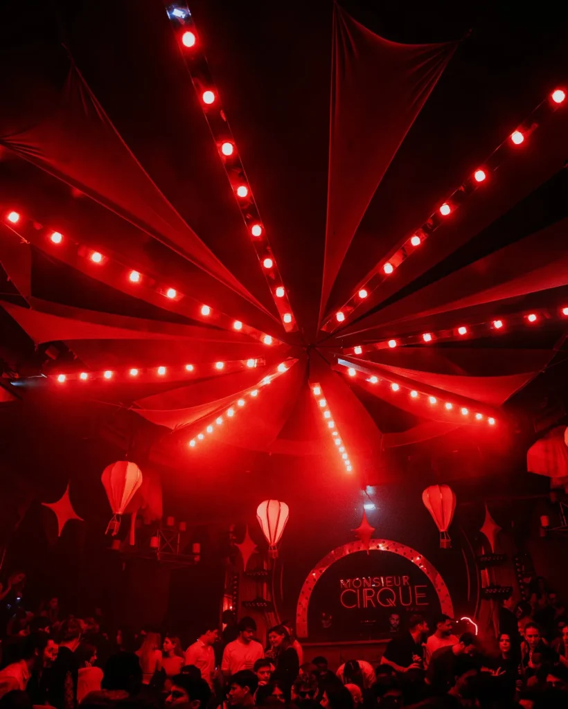 Dramatic red ceiling lights illuminating Boum Boum Paris nightclub