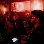 DJ booth and crowd inside Boum Boum Paris nightclub