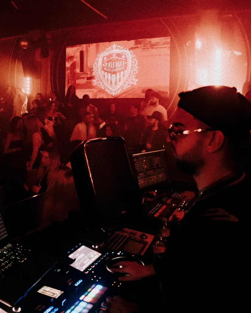 DJ booth and crowd inside Boum Boum Paris nightclub