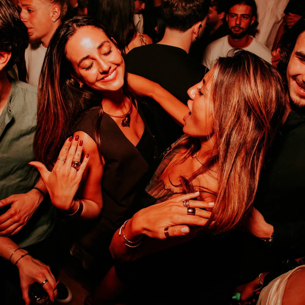 Guests enjoying the nightlife atmosphere at Boum Boum Paris