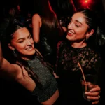 Guests enjoying the atmosphere inside Boum Boum Paris
