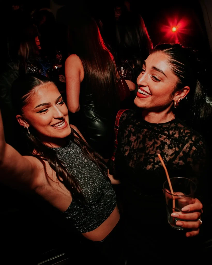 Guests enjoying the atmosphere inside Boum Boum Paris