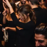 Crowd enjoying a lively night at Boum Boum Paris