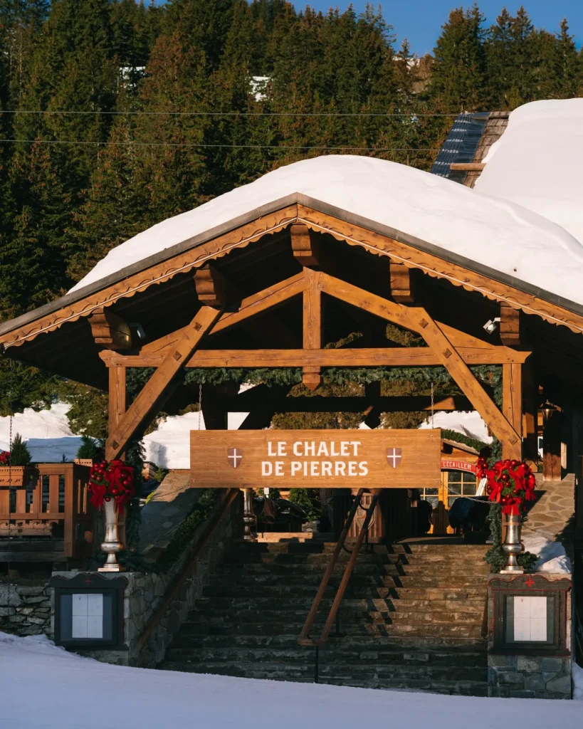 Snowy entrance to Chalet de Pierres restaurant in Courchevel