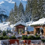 Snow-covered exterior of Chalet de Pierres in Courchevel