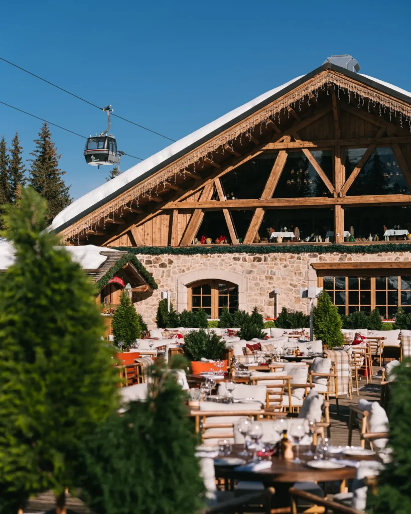 Alpine chalet exterior and outdoor terrace at Chalet de Pierres Courchevel