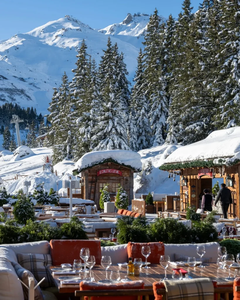 Snow-covered exterior of Chalet de Pierres in Courchevel