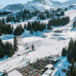 Aerial view of the snowy ski area around Chalet de Pierres in Courchevel