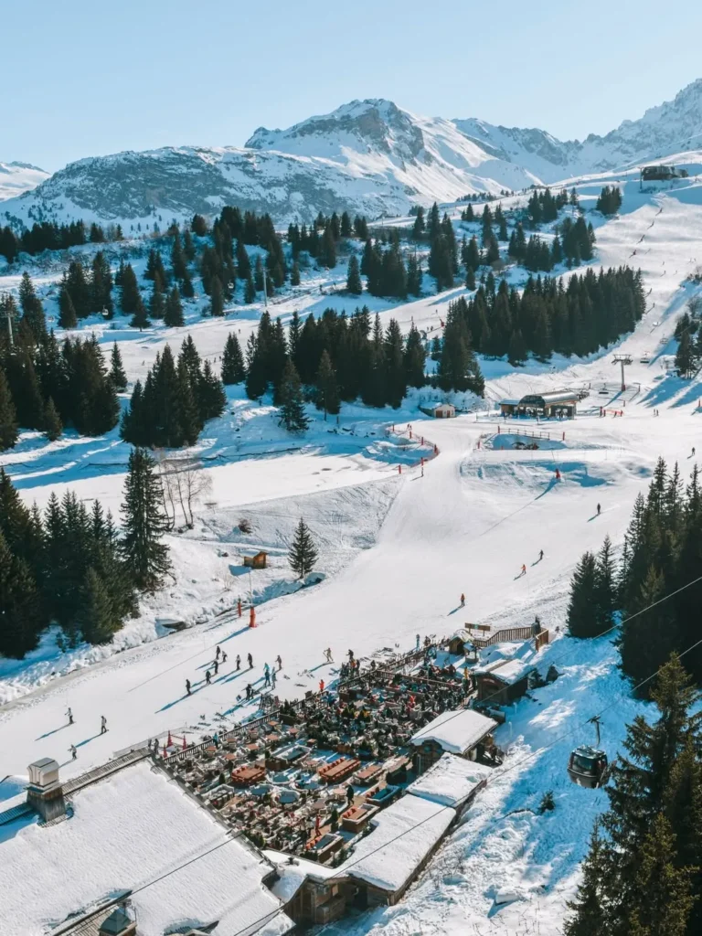 Aerial view of the snowy ski area around Chalet de Pierres in Courchevel