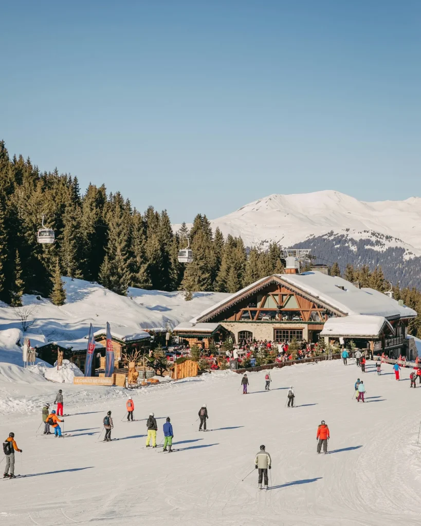 Chalet de Pierres overlooking the snowy ski slopes in Courchevel