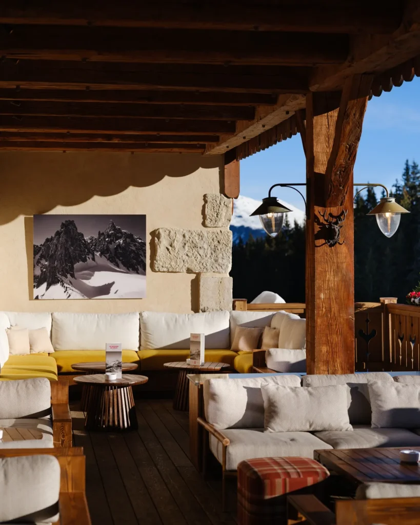 Covered lounge seating with alpine views at Chalet de Pierres Courchevel