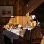 Cozy wood-paneled dining interior at Chalet de Pierres Courchevel