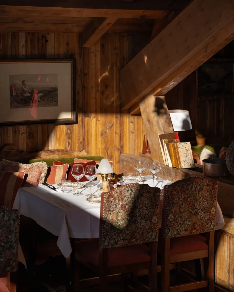 Cozy wood-paneled dining interior at Chalet de Pierres Courchevel