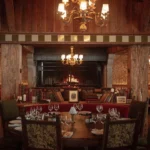 Warm wood-paneled dining room at Chalet de Pierres Courchevel
