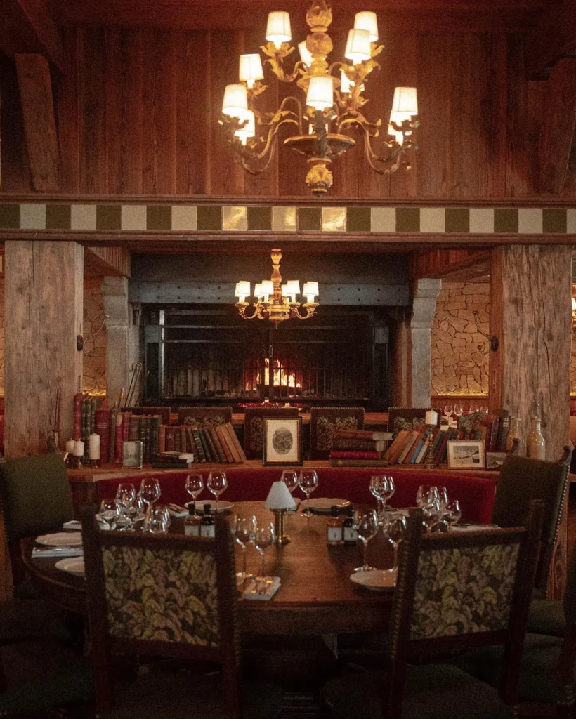 Warm wood-paneled dining room at Chalet de Pierres Courchevel