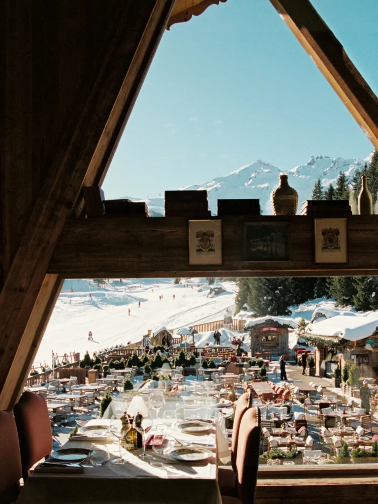 Dining terrace overlooking snowy mountains at Chalet de Pierres Courchevel