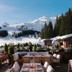 Outdoor dining terrace overlooking the mountains at Chalet de Pierres