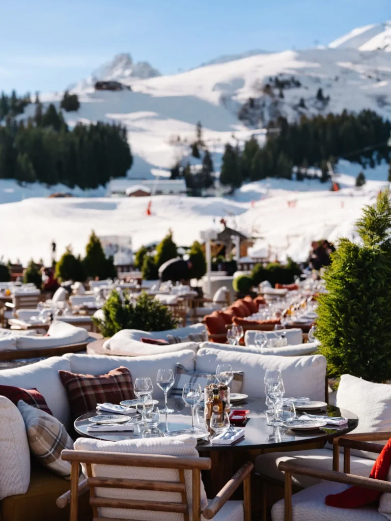 Outdoor dining terrace overlooking the alpine landscape at Chalet de Pierres