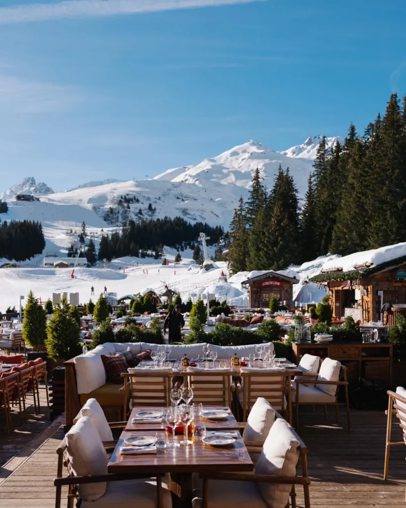 Outdoor dining terrace overlooking the mountains at Chalet de Pierres