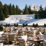 Outdoor dining terrace with mountain views at Chalet de Pierres Courchevel