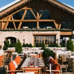Guests dining on the outdoor terrace at Chalet de Pierres Courchevel