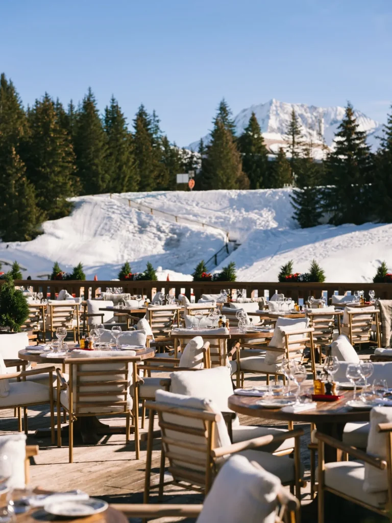 Outdoor dining terrace with mountain views at Chalet de Pierres Courchevel