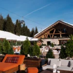 Outdoor dining terrace at Chalet de Pierres surrounded by alpine scenery