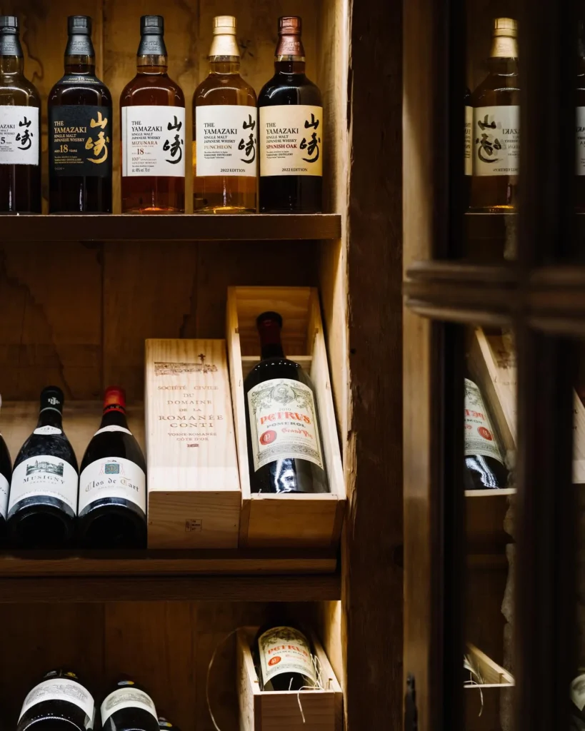 Wine bottles displayed in the cellar at Chalet de Pierres Courchevel