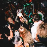 Guests dancing and celebrating inside Deflower Paris nightclub