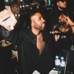 DJ performing at the booth inside Deflower Paris