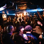 DJ performing to a packed crowd at Deflower Paris