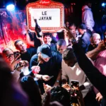 Packed crowd enjoying a live event at Deflower Paris nightclub
