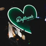 Illuminated Deflower neon sign inside the Paris nightclub