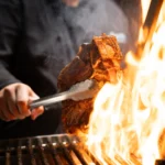 Argentine grilled meat being prepared at El Porteño Prohibido