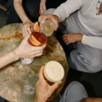 Guests pouring cocktails at El Porteño Prohibido