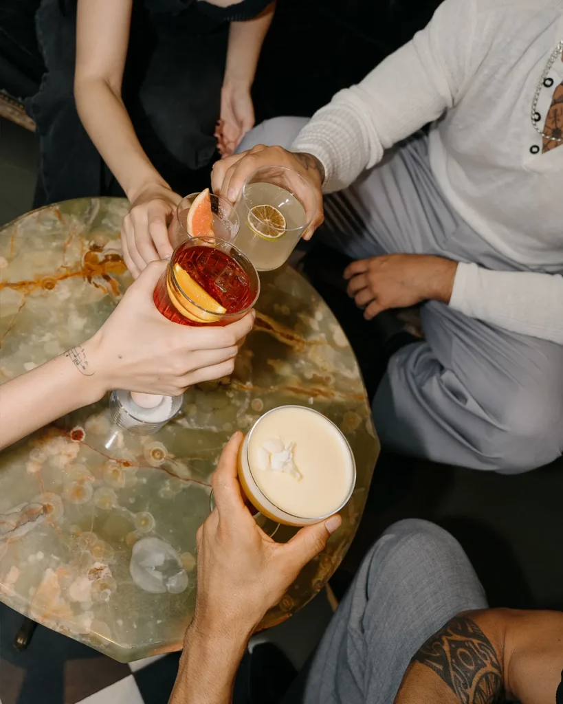 Guests pouring cocktails at El Porteño Prohibido