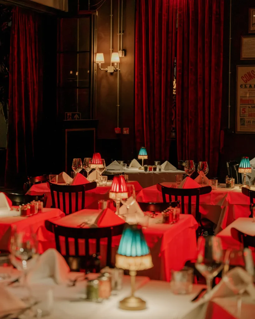 Red-lit dining room at El Porteño Prohibido